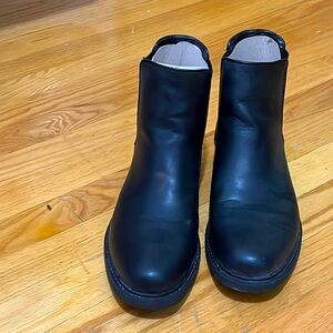 Black Calvin Klein boots.